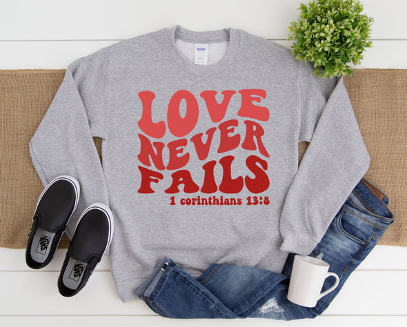 Love Never Fails Graphic Tee and Sweatshirt
